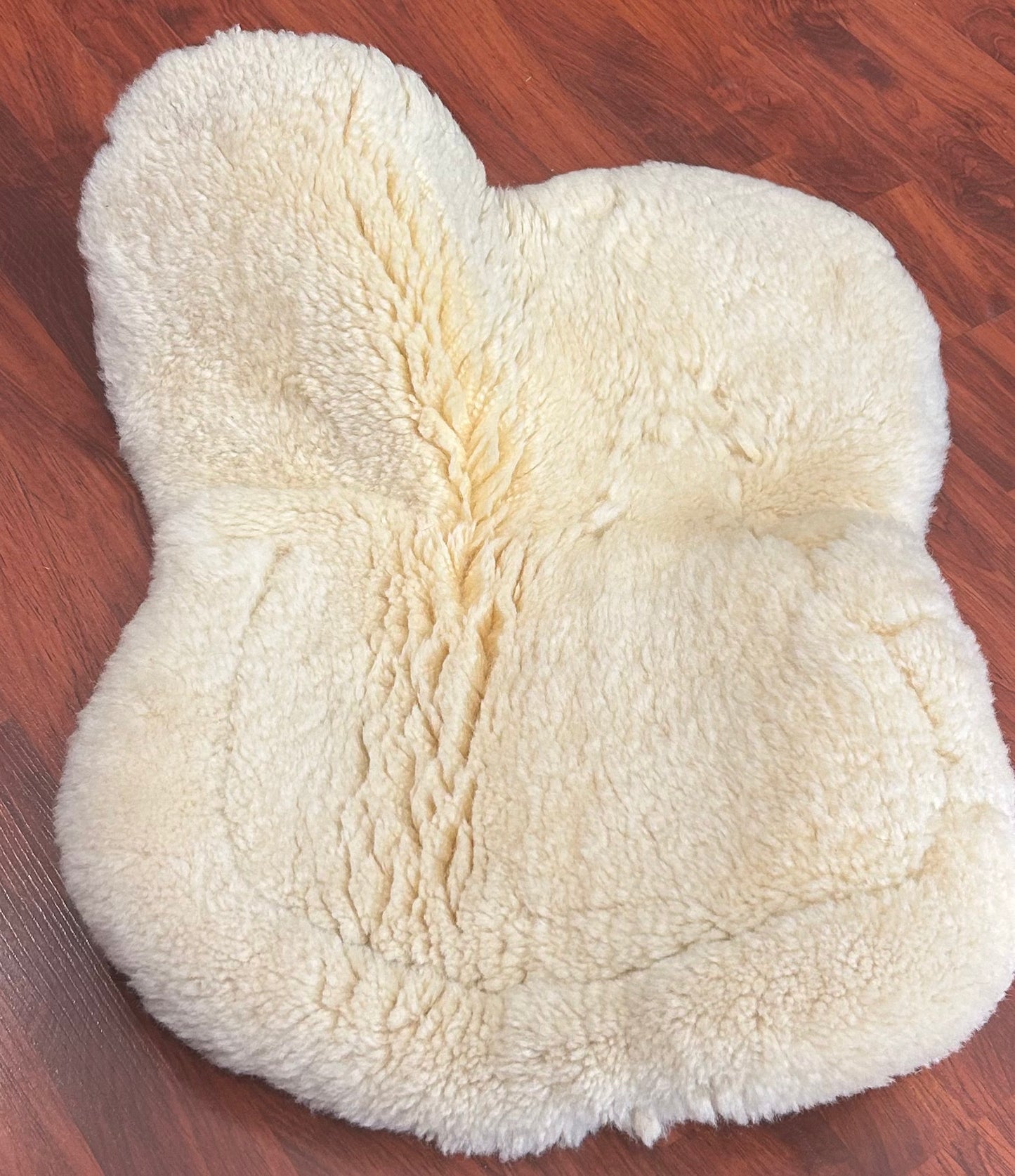 Sheepskin half pad saddle area measures 17.5” along spine