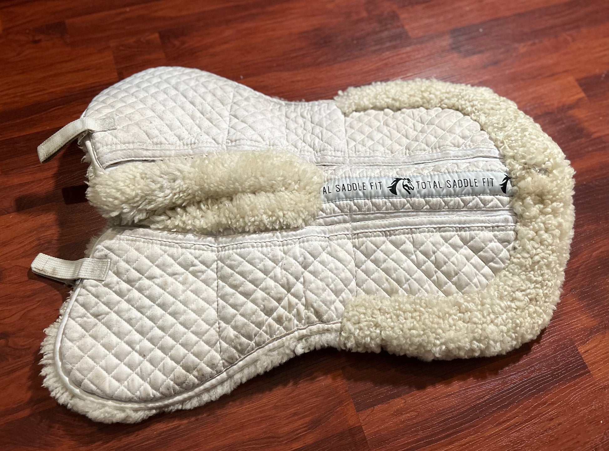 Total saddle fit shimmable half pad with wither relief. All About Tack