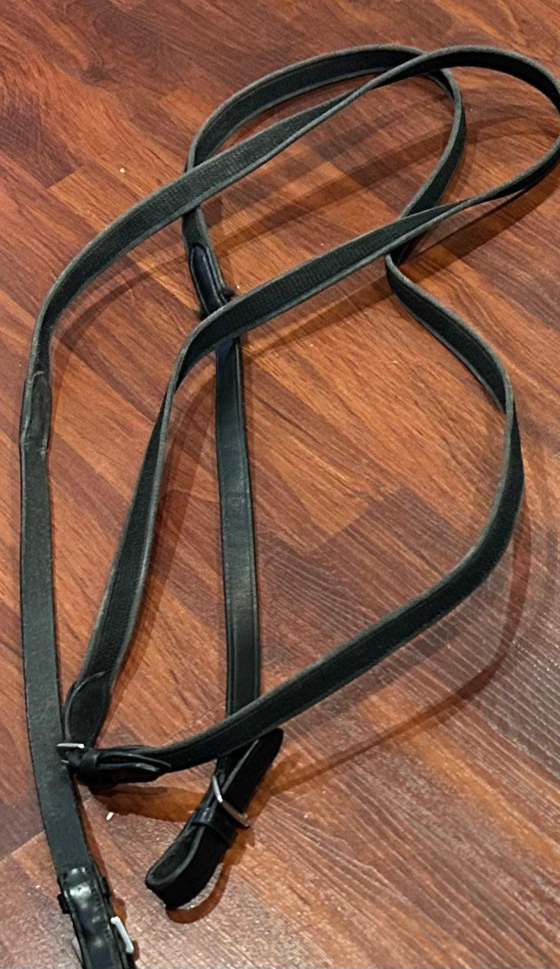 Red barn black leather reins with buckles. Nylon and rubber