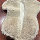Mattes medium white half pad. Some damage to sheepskin
