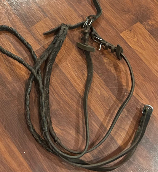 brown braided reins. Need cleaned. Buckle closures