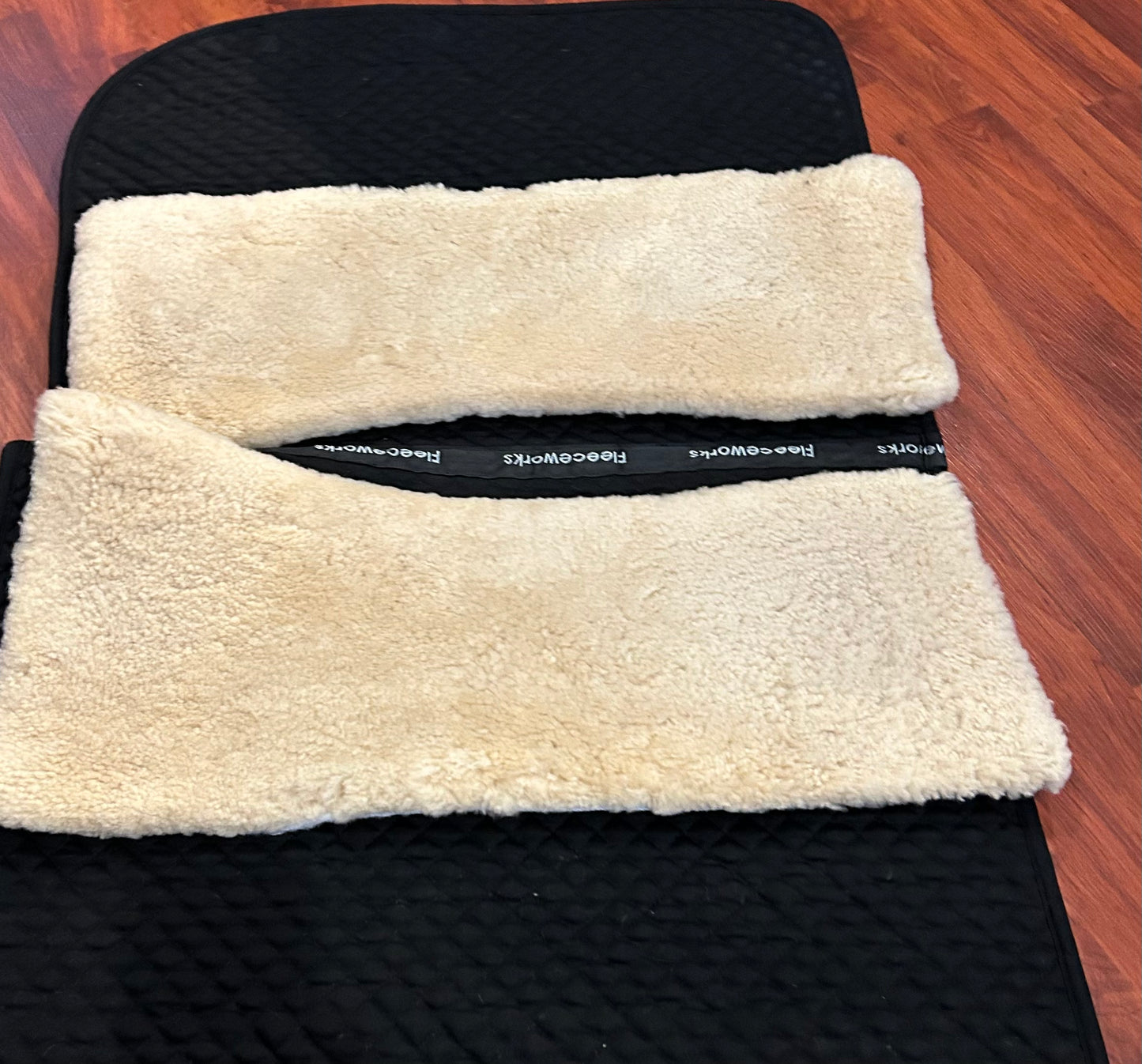 Fleeceworks 2 dressage pads (black and white) with removable set of Thera fleece panels and canvas storage bag.