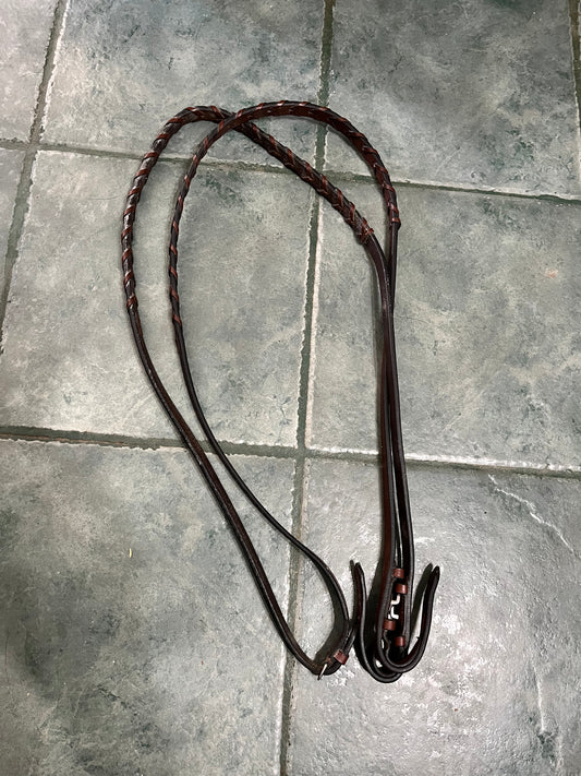 Braided brown leather reins
