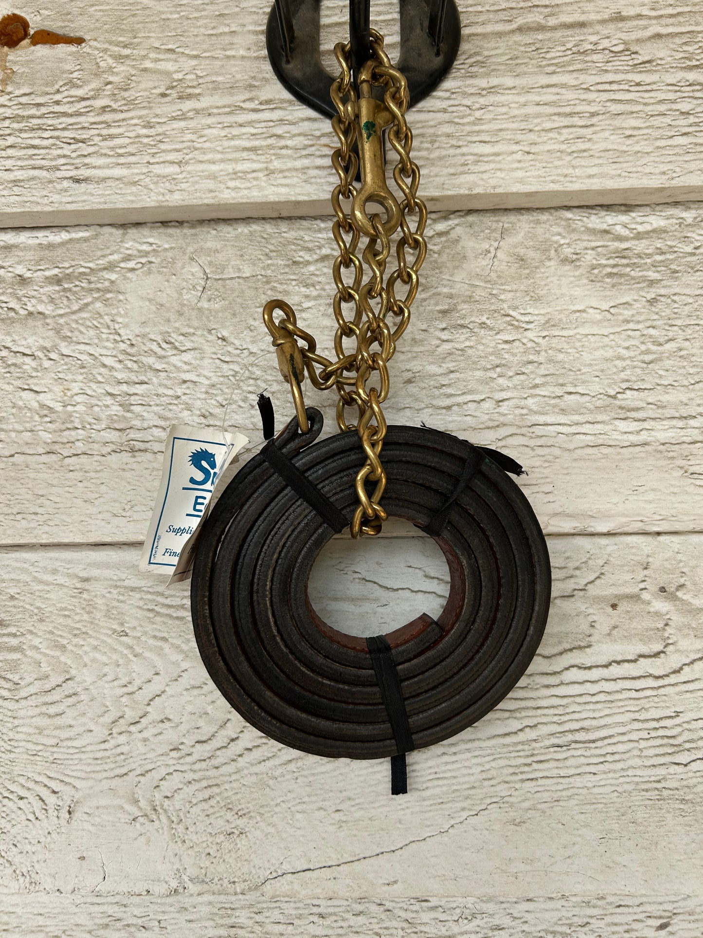 Brown leather lead with chain.
