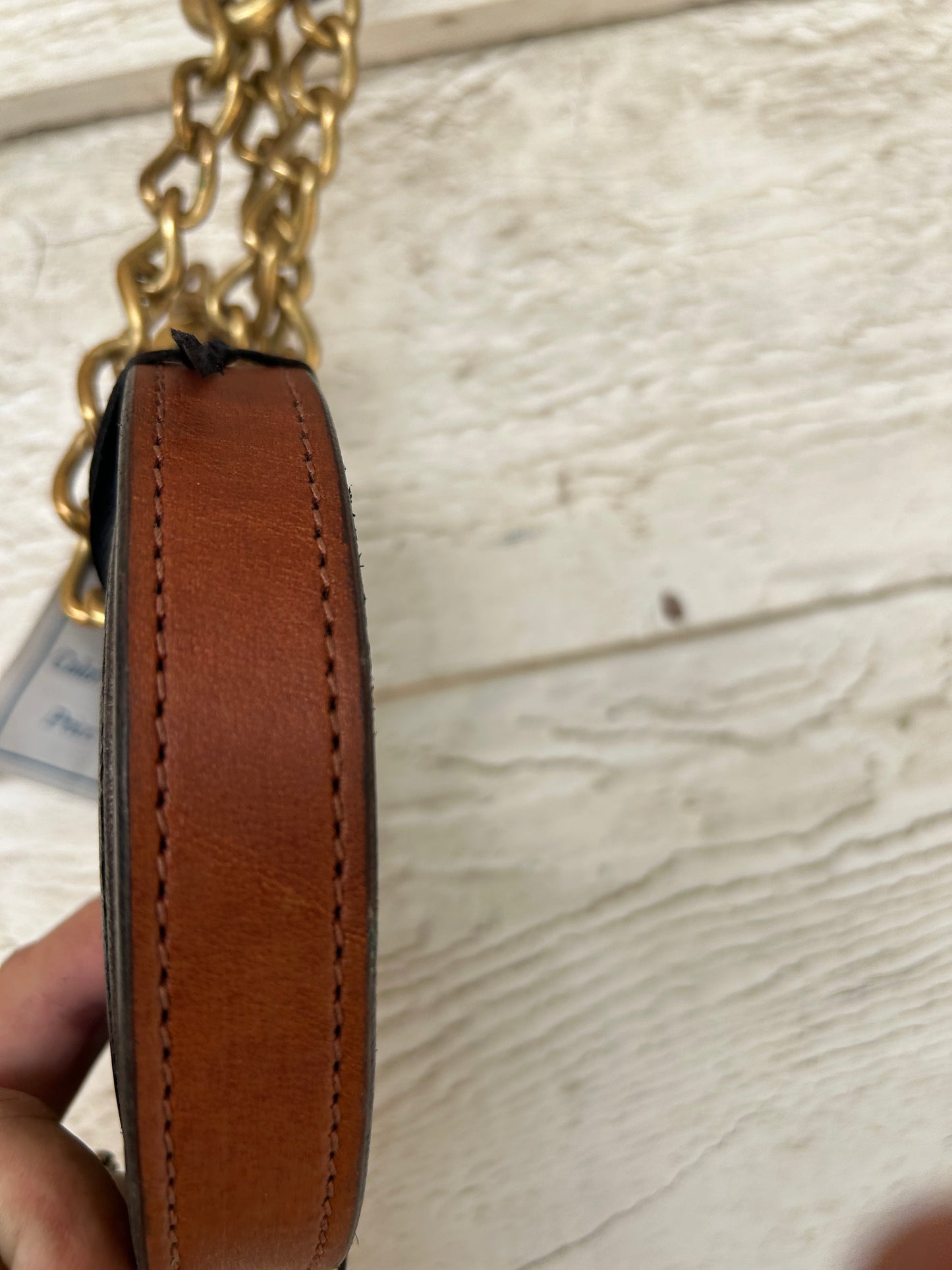 Brown leather lead with chain.