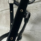 Full ride black leather halter with chrome hardware. Adjusts at chin. Clip. Has rivets on both cheek pieces. Brand new.